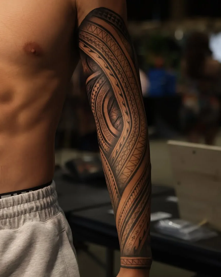 Tribal sleeve tattoo by Don Xavier