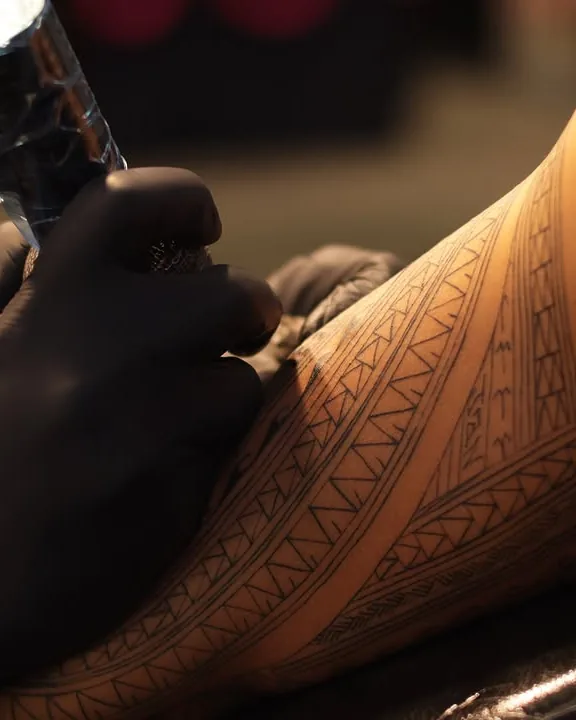Tribal, mid-session close-up tattoo by Don Xavier