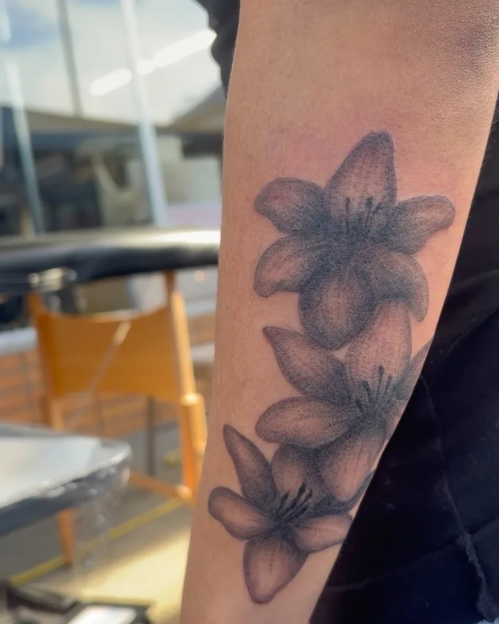 Lilies tattoo by Lil Angel